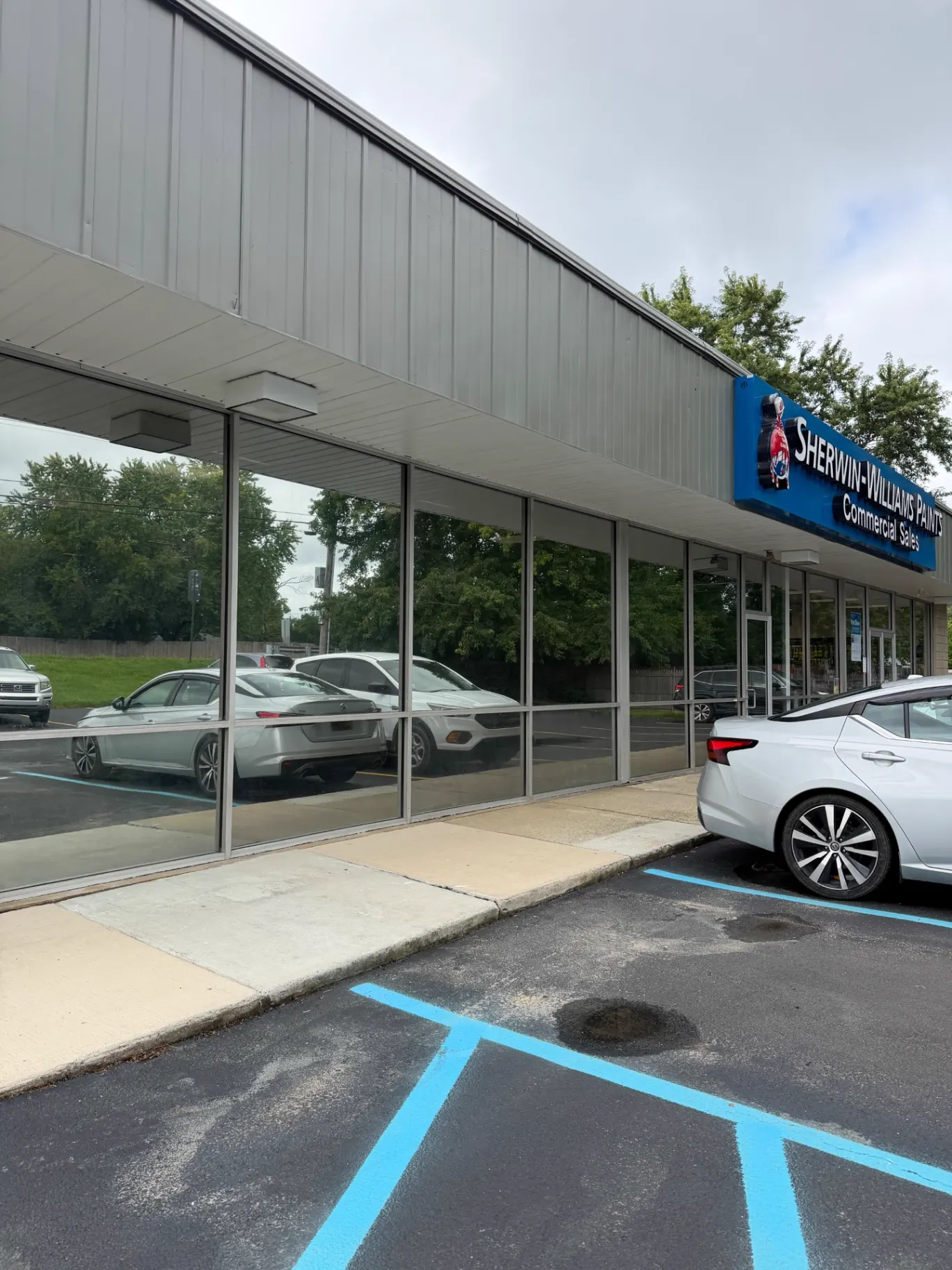 Reflective storefront glazing at the Sherwin-Williams location in Newark